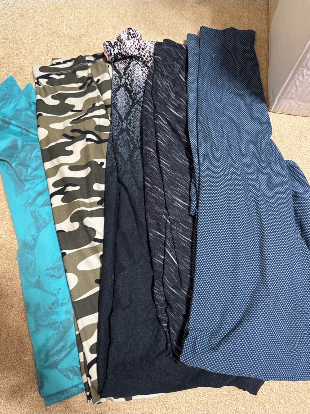 Set of 5 LuLaRoe leggings in size Tall/Curvy. See photos for mix of patterns